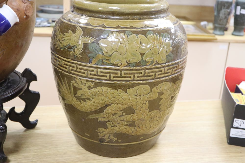 A Chinese straits earthenware matavan and a stoneware vessel on stand